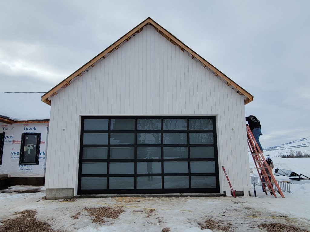 20240122_151806 Newly installed garage door with glass panels - quality garage door services by Homeland Doors
