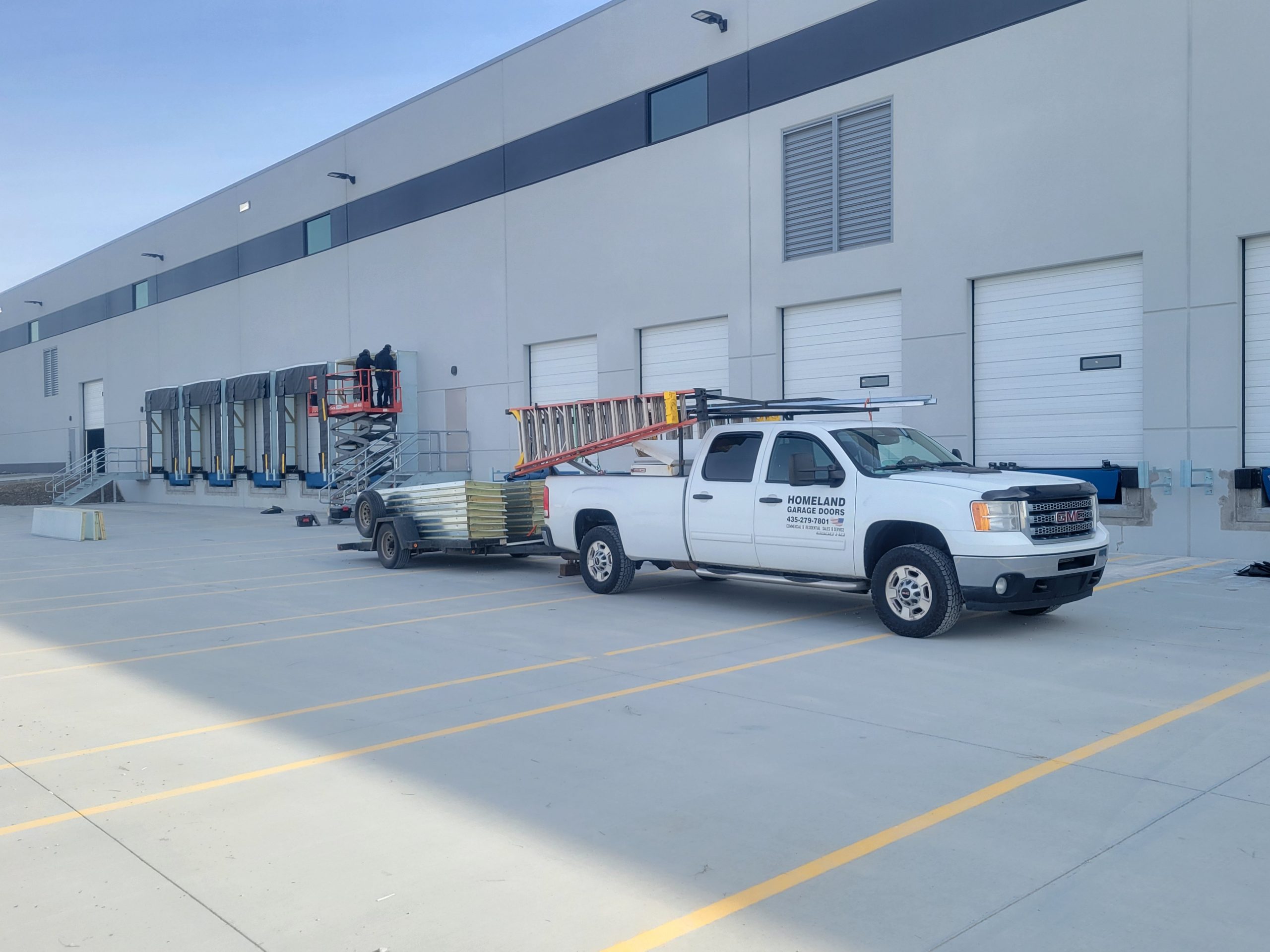 Work truck outside an industrial building