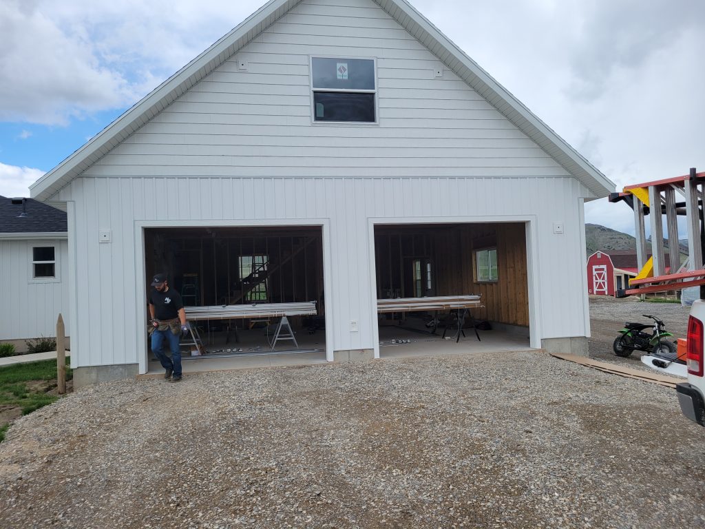 20240429_121621 Double garage doors that are open